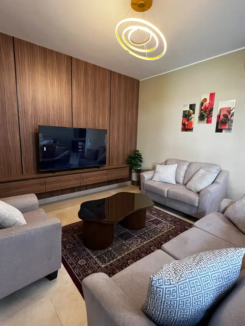 Pool-View Balcony and Ring Chandeliers — 3-Bedroom Apartment, New Cairo