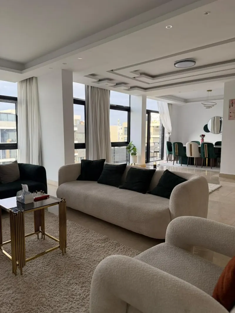 Emerald Dining over the Fountain Court — 3-Bedroom Apartment, New Cairo