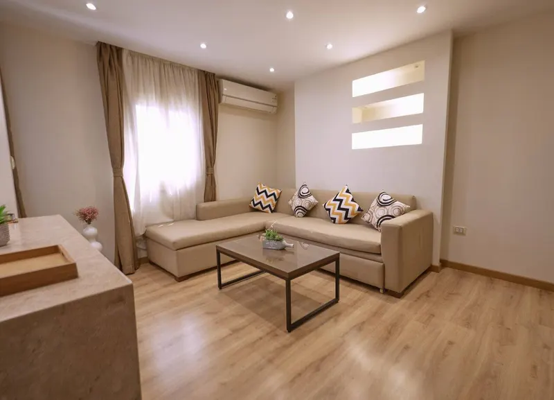 Nasr City 1-Bedroom with Backlit Wall Niches and Bar Seating, photo 4