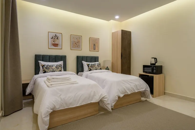 Roomy Heliopolis Airport Twin Room with Botanical Prints, Upper Floor