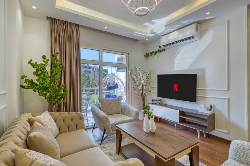 Egg-Chair Balcony Home — 2-Bedroom, Madinaty